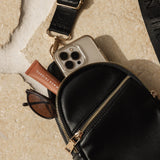 The Louenhide Bella Sling Bag is designed with both style and functionality in mind. Travel organization has never been easier with the dual compartment design ensuring your valuables are within reach and secured safely with the zip closures. Featuring an adjustable and detachable strap allows you to choose the way your bag slings. Whether over your left or right shoulder, this faux leather sling bag ensures comfortable all-day wear. This small sling backpack adds a refined touch to any casual outfit, enhan
