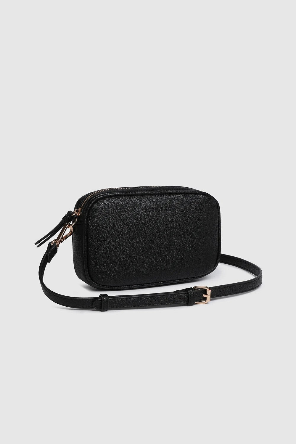 A black rectangular crossbody camera bag with a zippered top and an adjustable shoulder strap, shown on a light gray background.