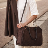 The Louenhide Blaire Tote Bag is the definition of an effortless, statement style. Designed with a bold and unique silhouette, this large tote bag is the perfect throw and go piece with an elevated edge. Designed to have a spacious interior, you can easily fit your daily essentials – and then some. Whether en route to work or heading out for the day, wear it over the shoulder or carry in hand, and let the day unfold. A refined take on an everyday essential, the Blaire Tote Bag blends structure and softness 