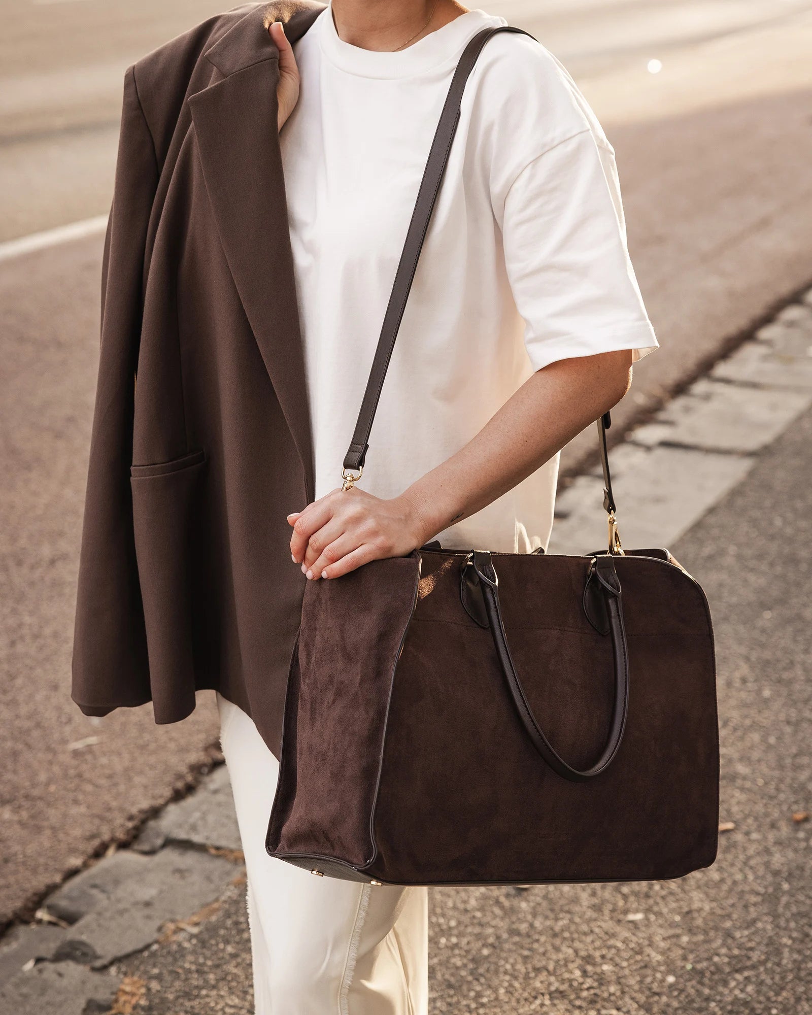 The Louenhide Blaire Tote Bag is the definition of an effortless, statement style. Designed with a bold and unique silhouette, this large tote bag is the perfect throw and go piece with an elevated edge. Designed to have a spacious interior, you can easily fit your daily essentials – and then some. Whether en route to work or heading out for the day, wear it over the shoulder or carry in hand, and let the day unfold. A refined take on an everyday essential, the Blaire Tote Bag blends structure and softness 