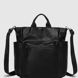 A black pebbled faux-leather bag with top handles, a front zippered pocket, and an adjustable shoulder strap, shown against a light gray background.
