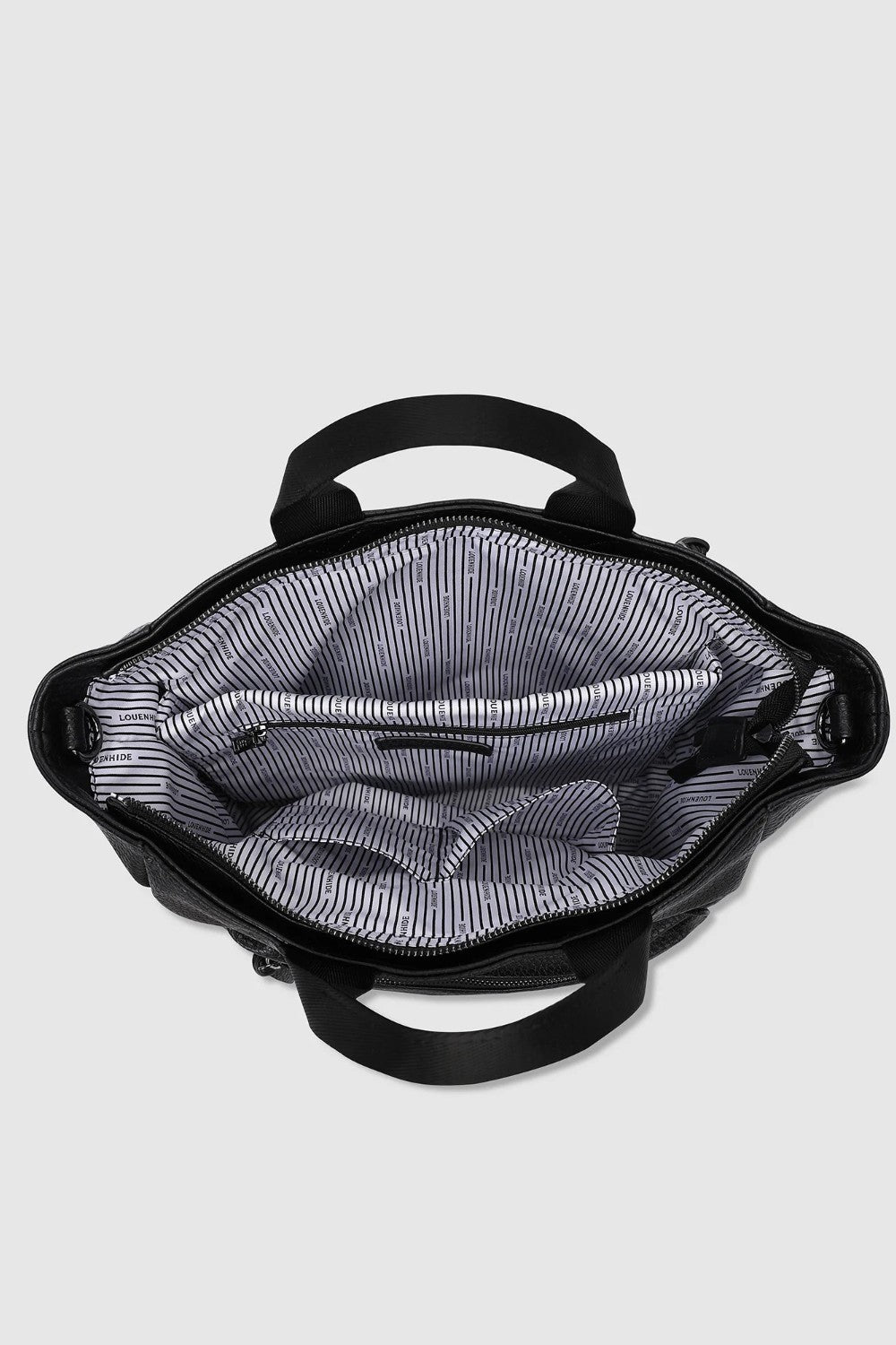 Top-down view of an open black handbag showing a gray and white striped interior lining, set against a light gray background.