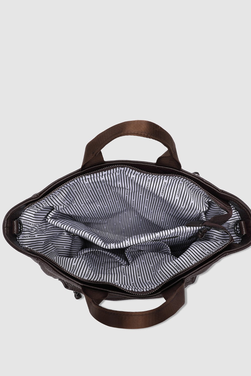 Open brown pleather bag with striped lining on a light gray background