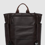 Brown leather backpack on a white background