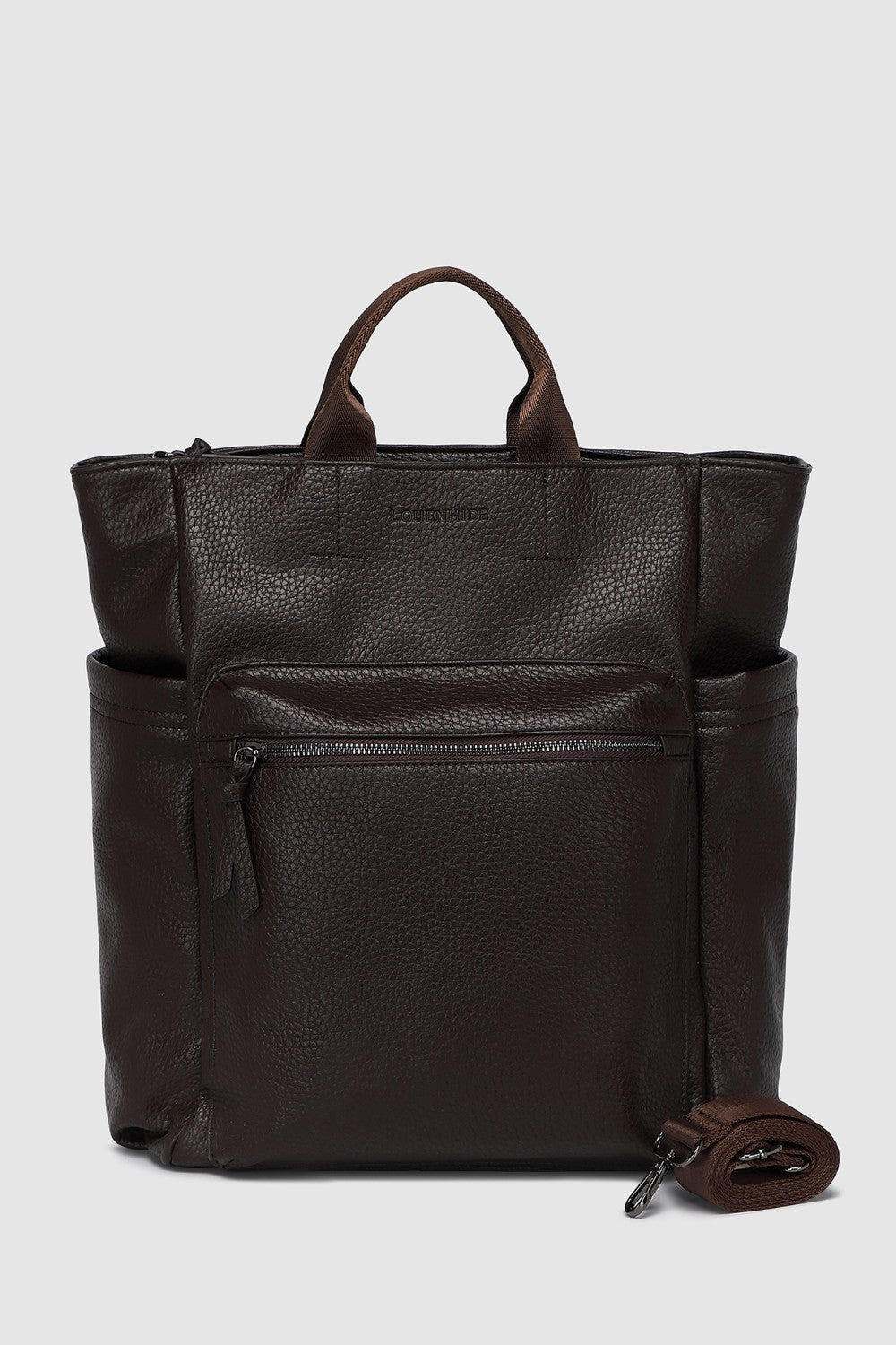 Brown pleather backpack with multiple pockets on a light gray background