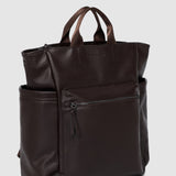 Brown pleather backpack on a light gray background