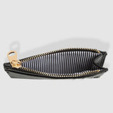 Black zippered pouch with gold zipper on a white background