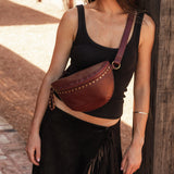 The Louenhide Cassidy Belt Bag is a bold staple designed to add a statement finish to your everyday styling. Crafted in a structured faux leather and adorned with refined hardware accents, this studded bag blends functionality with elevated design.