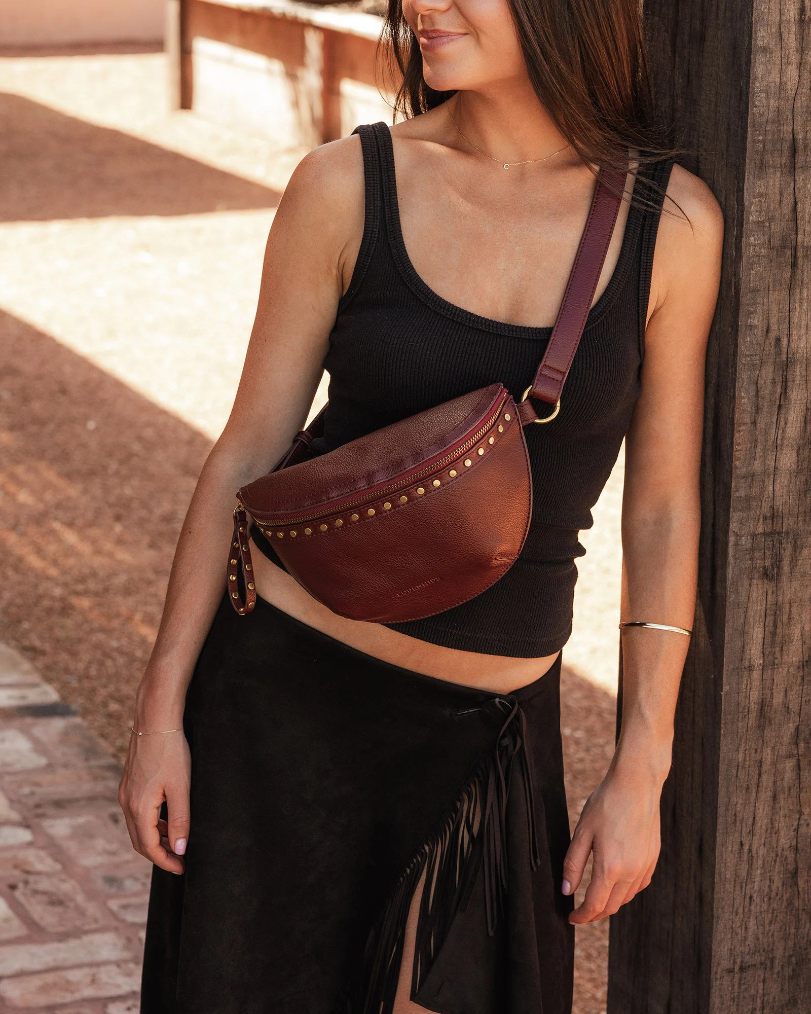 The Louenhide Cassidy Belt Bag is a bold staple designed to add a statement finish to your everyday styling. Crafted in a structured faux leather and adorned with refined hardware accents, this studded bag blends functionality with elevated design.
