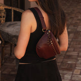 The Louenhide Cassidy Belt Bag is a bold staple designed to add a statement finish to your everyday styling. Crafted in a structured faux leather and adorned with refined hardware accents, this studded bag blends functionality with elevated design.