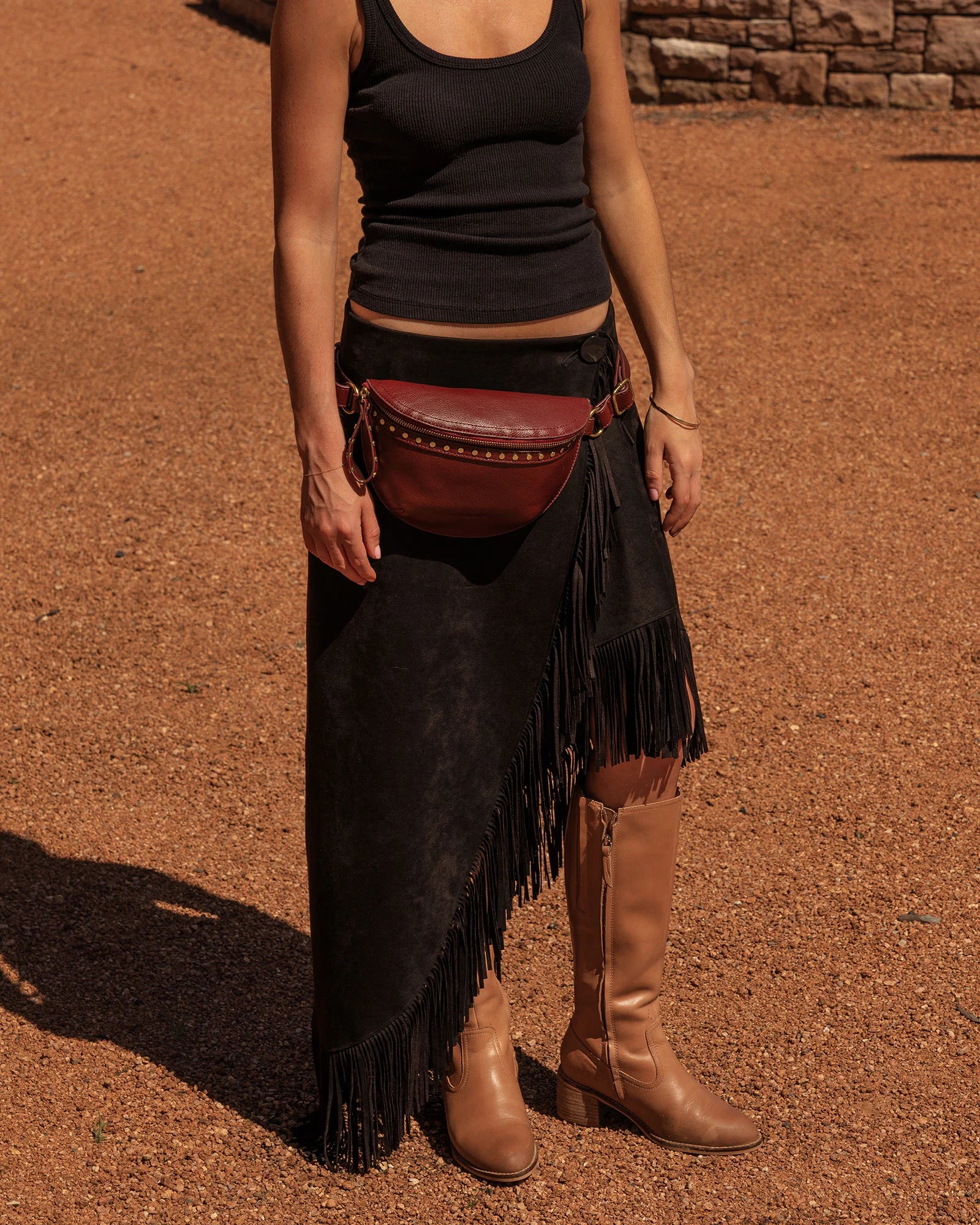 The Louenhide Cassidy Belt Bag is a bold staple designed to add a statement finish to your everyday styling. Crafted in a structured faux leather and adorned with refined hardware accents, this studded bag blends functionality with elevated design.