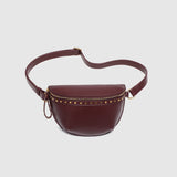 The Louenhide Cassidy Belt Bag is a bold staple designed to add a statement finish to your everyday styling. Crafted in a structured faux leather and adorned with refined hardware accents, this studded bag blends functionality with elevated design.