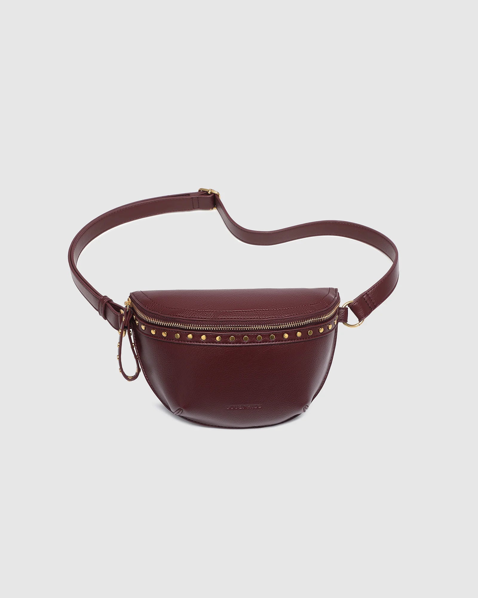 The Louenhide Cassidy Belt Bag is a bold staple designed to add a statement finish to your everyday styling. Crafted in a structured faux leather and adorned with refined hardware accents, this studded bag blends functionality with elevated design.