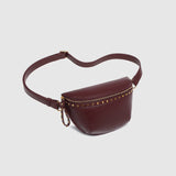 The Louenhide Cassidy Belt Bag is a bold staple designed to add a statement finish to your everyday styling. Crafted in a structured faux leather and adorned with refined hardware accents, this studded bag blends functionality with elevated design.
