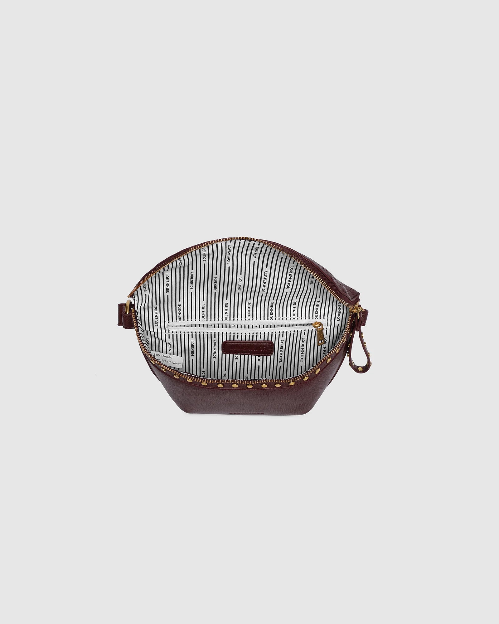 The Louenhide Cassidy Belt Bag is a bold staple designed to add a statement finish to your everyday styling. Crafted in a structured faux leather and adorned with refined hardware accents, this studded bag blends functionality with elevated design.