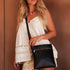 The Louenhide Cressida Crossbody Bag is your go-to for everyday ease and streamlined functionality. Designed in rich, seasonal hues, this crossbody handbag is both timeless and practical. The structured silhouette offers a spacious interior to keep your daily essentials organized, while the secure zip closures ensure everything stays in place. Whether worn over the shoulder or across the body, the adjustable strap lets you tailor the fit to suit your day. With subtle design detailing and a sleek shape, this