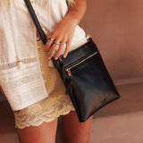 The Louenhide Cressida Crossbody Bag is your go-to for everyday ease and streamlined functionality. Designed in rich, seasonal hues, this crossbody handbag is both timeless and practical. The structured silhouette offers a spacious interior to keep your daily essentials organized, while the secure zip closures ensure everything stays in place. Whether worn over the shoulder or across the body, the adjustable strap lets you tailor the fit to suit your day. With subtle design detailing and a sleek shape, this
