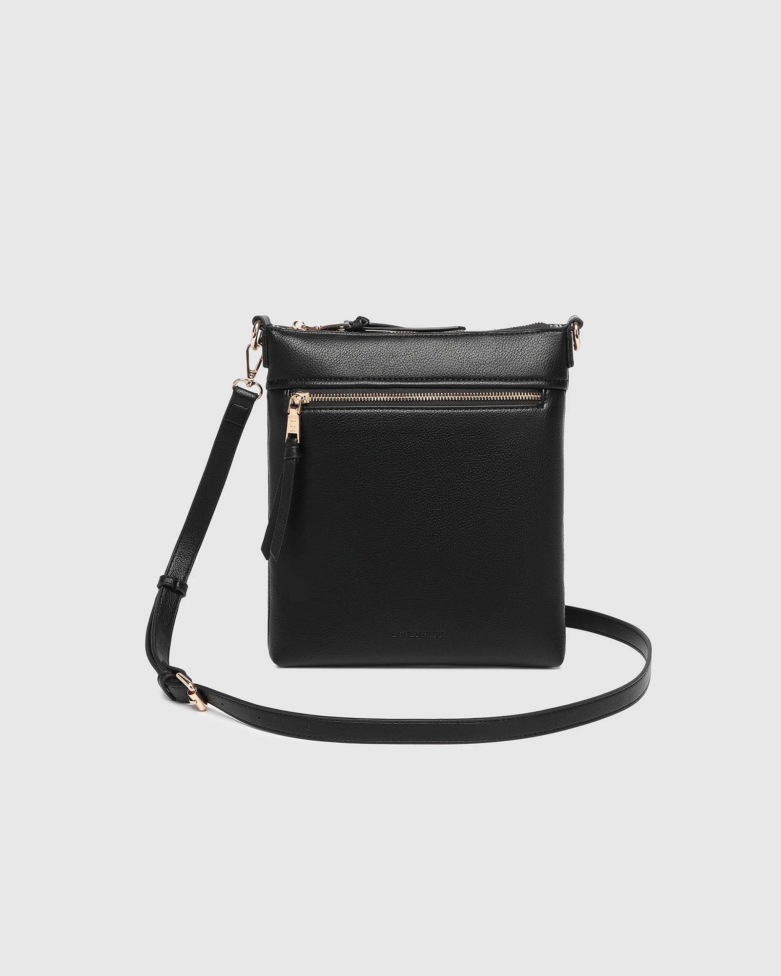 The Louenhide Cressida Crossbody Bag is your go-to for everyday ease and streamlined functionality. Designed in rich, seasonal hues, this crossbody handbag is both timeless and practical. The structured silhouette offers a spacious interior to keep your daily essentials organized, while the secure zip closures ensure everything stays in place. Whether worn over the shoulder or across the body, the adjustable strap lets you tailor the fit to suit your day. With subtle design detailing and a sleek shape, this