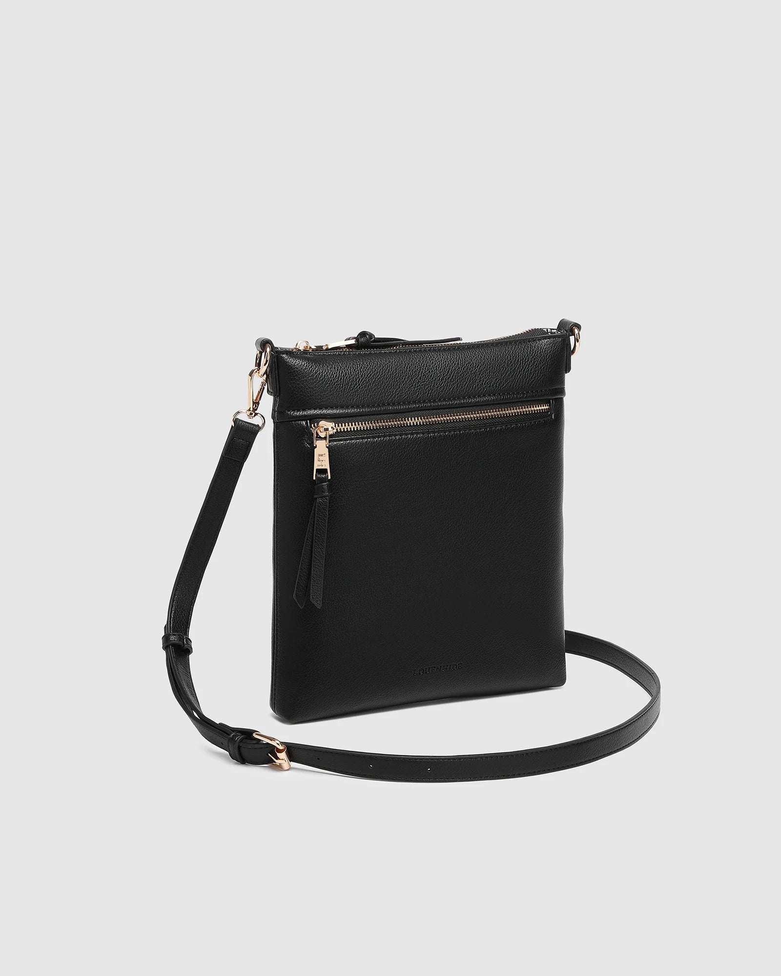 The Louenhide Cressida Crossbody Bag is your go-to for everyday ease and streamlined functionality. Designed in rich, seasonal hues, this crossbody handbag is both timeless and practical. The structured silhouette offers a spacious interior to keep your daily essentials organized, while the secure zip closures ensure everything stays in place. Whether worn over the shoulder or across the body, the adjustable strap lets you tailor the fit to suit your day. With subtle design detailing and a sleek shape, this