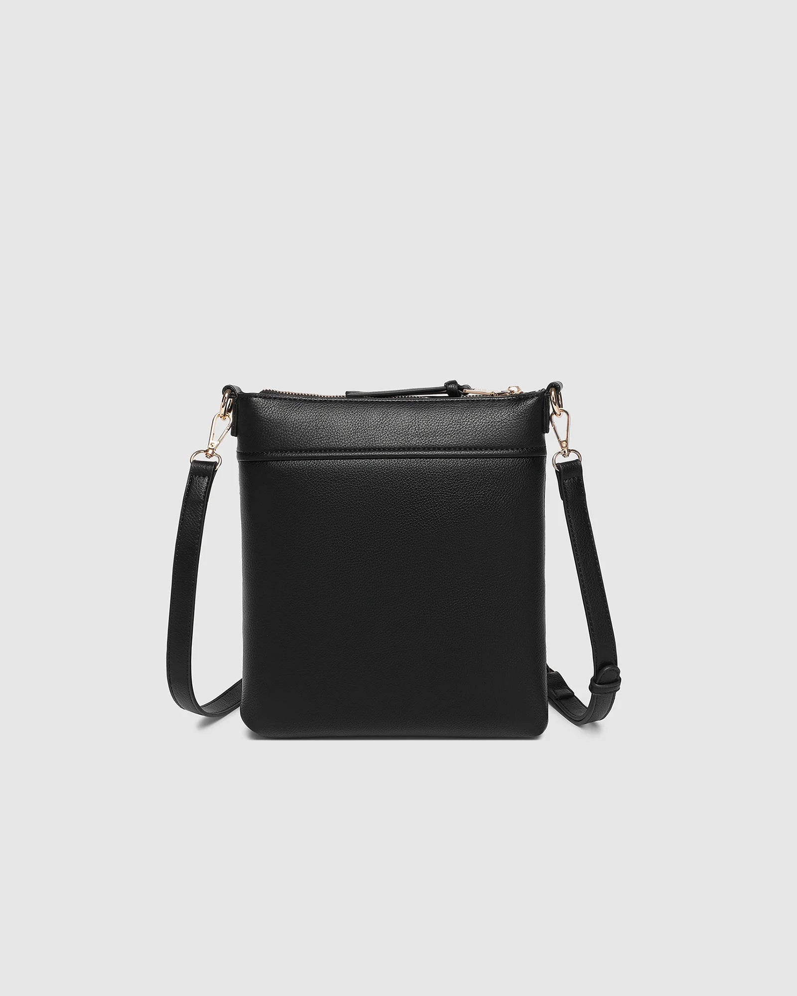 The Louenhide Cressida Crossbody Bag is your go-to for everyday ease and streamlined functionality. Designed in rich, seasonal hues, this crossbody handbag is both timeless and practical. The structured silhouette offers a spacious interior to keep your daily essentials organized, while the secure zip closures ensure everything stays in place. Whether worn over the shoulder or across the body, the adjustable strap lets you tailor the fit to suit your day. With subtle design detailing and a sleek shape, this