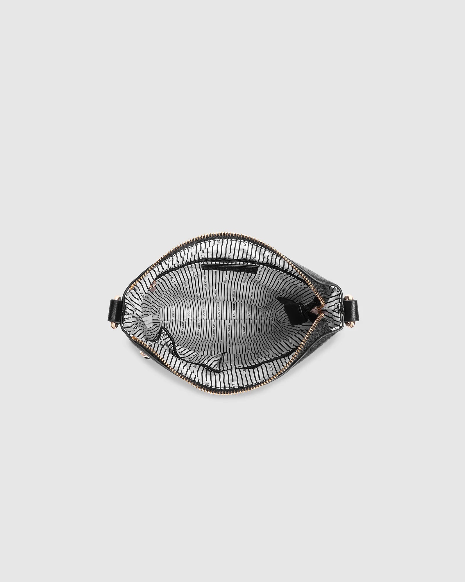The Louenhide Cressida Crossbody Bag is your go-to for everyday ease and streamlined functionality. Designed in rich, seasonal hues, this crossbody handbag is both timeless and practical. The structured silhouette offers a spacious interior to keep your daily essentials organized, while the secure zip closures ensure everything stays in place. Whether worn over the shoulder or across the body, the adjustable strap lets you tailor the fit to suit your day. With subtle design detailing and a sleek shape, this