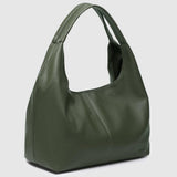 An olive green slouchy shoulder bag with a smooth leather-like finish, shown from a three-quarter angle on a light gray background.