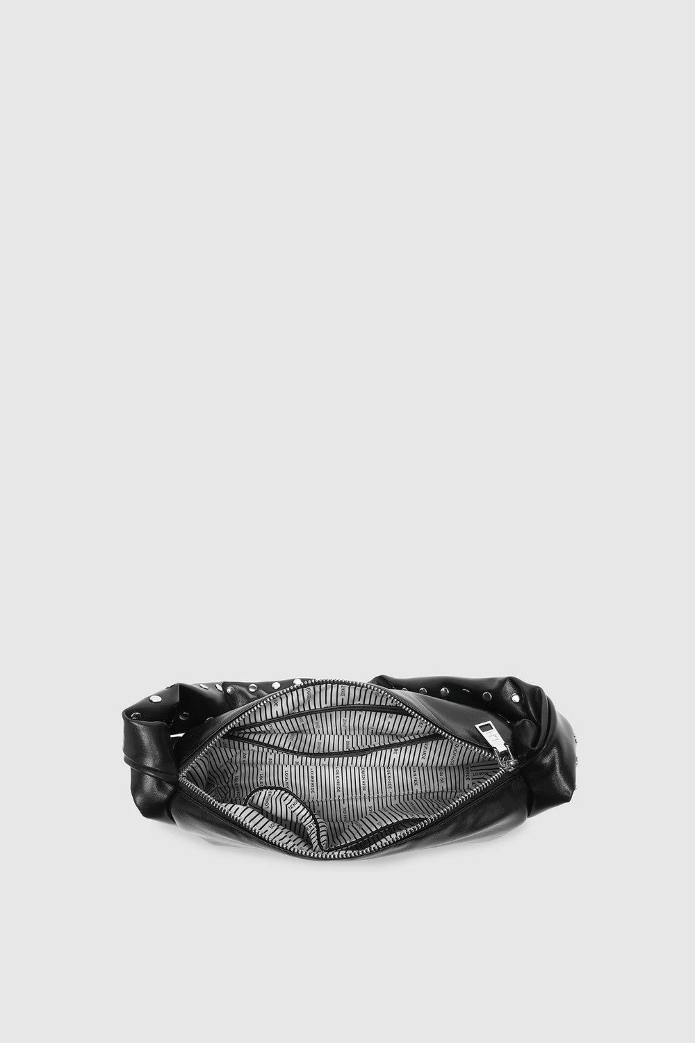 Looking down on an open black handbag with striped lining and silver zip closure