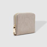 The Louenhide Eden Wallet is where functional simplicity meets enduring style. This classic everyday essential showcases a minimalistic design and clean lines on a smooth vegan leather exterior. Despite its compact size, the classic silhouette boasts ample space for your essentials. Stay organized at your convenience with multiple card holders, a dedicated slip pocket for your notes and receipts, and a zipped coin pocket to ensure you carry what you need without unnecessary bulk.