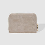 The Louenhide Eden Wallet is where functional simplicity meets enduring style. This classic everyday essential showcases a minimalistic design and clean lines on a smooth vegan leather exterior. Despite its compact size, the classic silhouette boasts ample space for your essentials. Stay organized at your convenience with multiple card holders, a dedicated slip pocket for your notes and receipts, and a zipped coin pocket to ensure you carry what you need without unnecessary bulk.