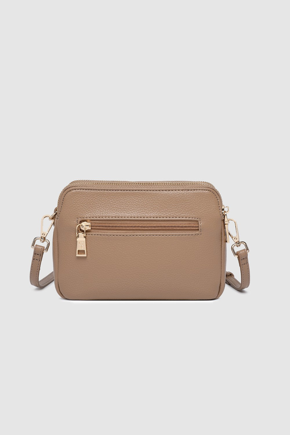Beige crossbody bag on a light gray background