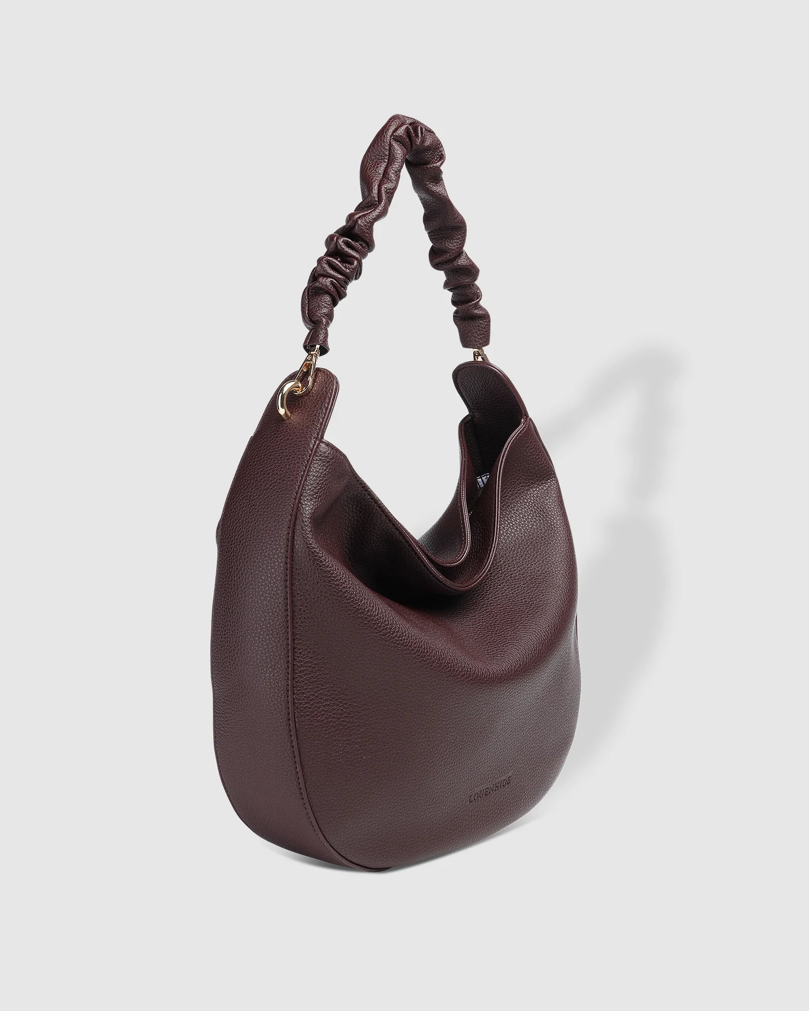 The Louenhide Emily Shoulder Bag is a contemporary women’s hobo bag with an elevated style. Exuding a relaxed feel, this women’s everyday bag showcases a classic and timeless style that features a gorgeous, ruched shoulder strap.