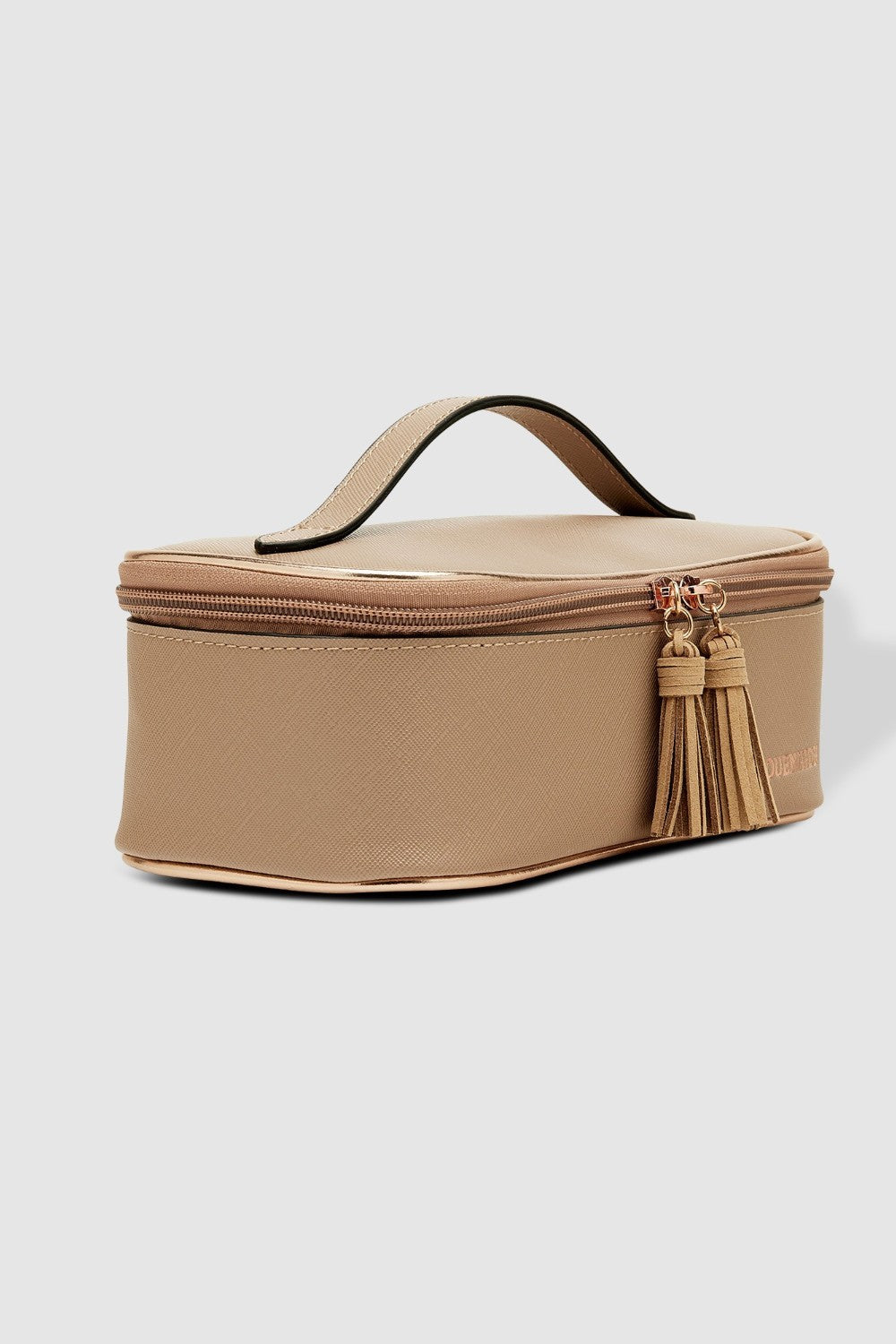 Beige cosmetic bag with a tassel on a light gray background