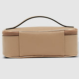 Beige cosmetic bag with a handle on a light gray background