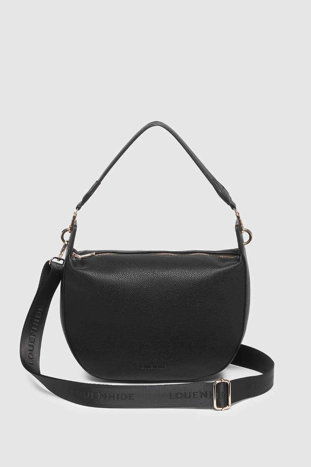 A black pebbled leather shoulder bag with a top handle and a detachable shoulder strap, shown against a light gray background. The brand name 'LOUENHIDE' is embossed on the strap.