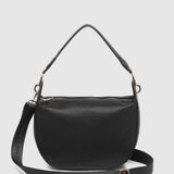 A black pebbled leather shoulder bag with a top handle and a detachable shoulder strap, shown against a light gray background. The brand name 'LOUENHIDE' is embossed on the strap.