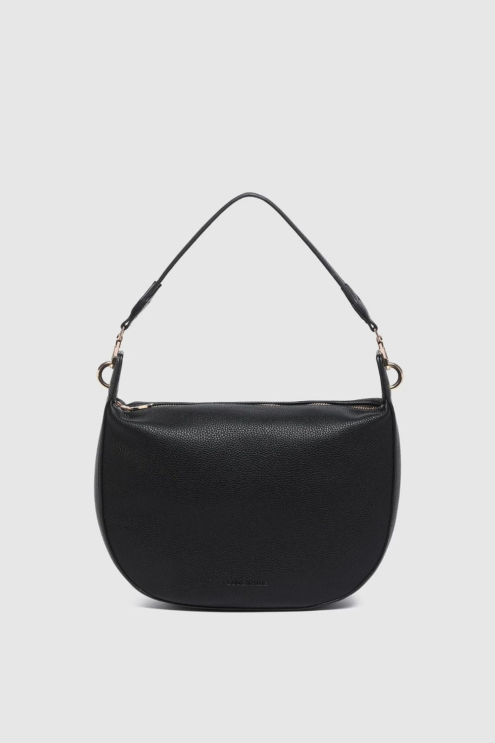 A black pebbled leather crescent-shaped shoulder bag with a single thin shoulder strap and gold-tone hardware, shown against a light gray background.