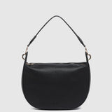 A black pebbled leather crescent-shaped shoulder bag with a single thin shoulder strap and gold-tone hardware, shown against a light gray background.