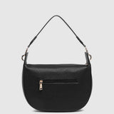 A black pebbled leather shoulder bag with a curved, crescent-shaped silhouette, a outside zippered pocket, and a thin matching shoulder strap, shown against a light gray background.