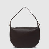 A dark brown pebbled leather shoulder bag with a single thin strap and gold-tone hardware, shown against a light gray background.
