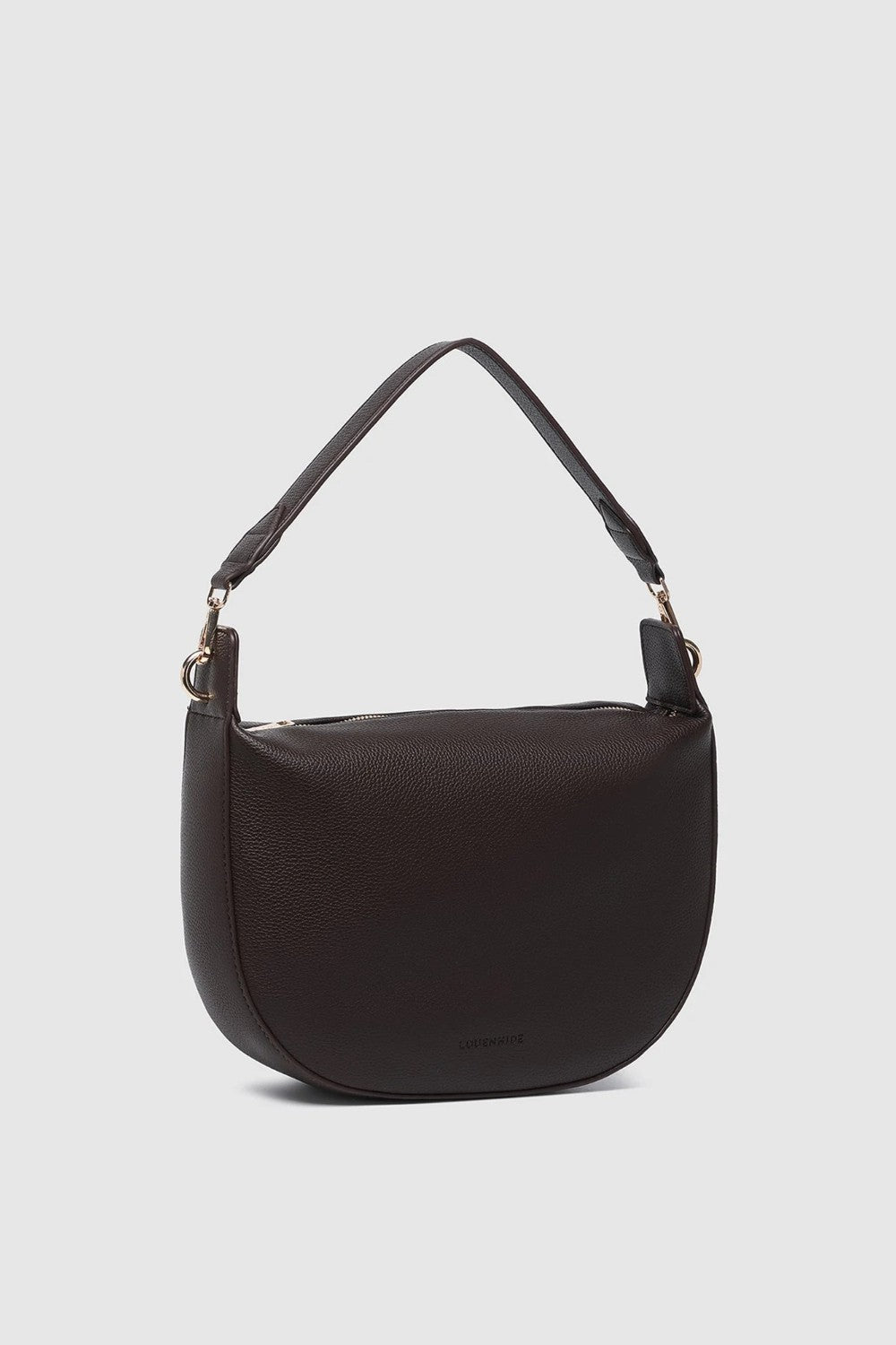 A dark brown pebbled leather crescent-shaped shoulder bag with a single shoulder strap and gold-tone hardware, shown against a light gray background.