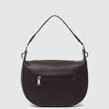 A dark brown textured leather shoulder bag with an exterior zippered pocket and gold-tone hardware, shown against a light gray background.
