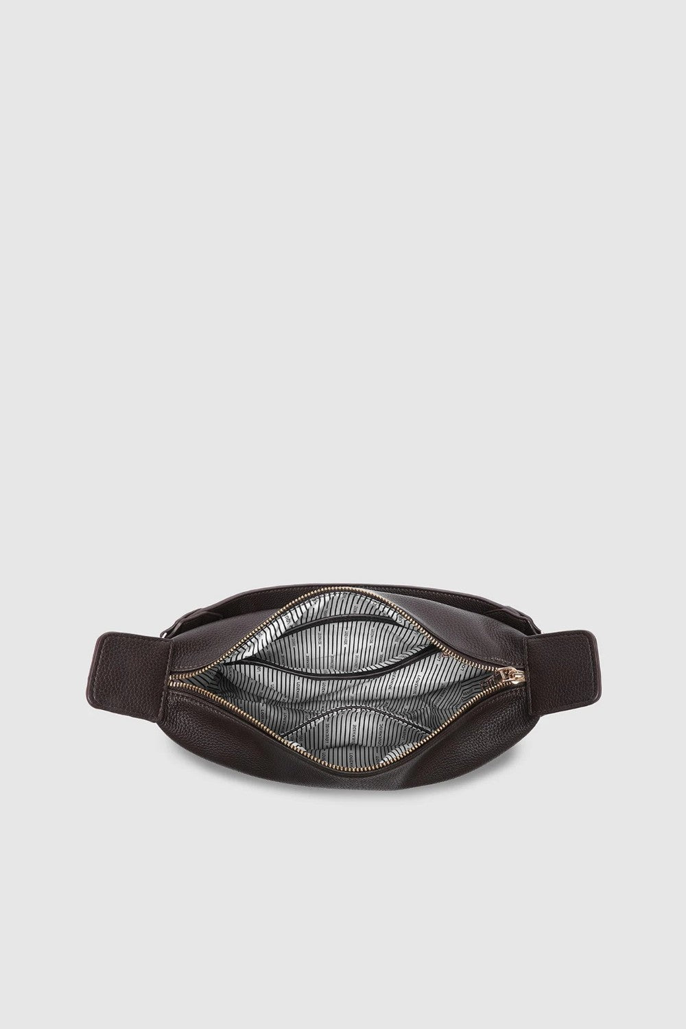 A dark brown leather belt bag shown from the top, open to reveal a striped interior lining, set against a solid light gray background.
