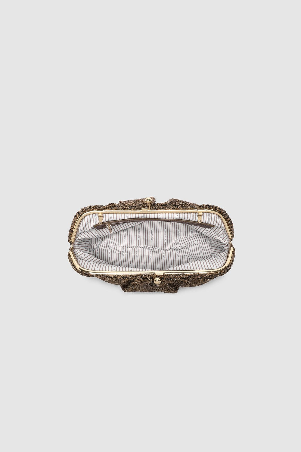 Vintage-style handbag with intricate design on a light gray background