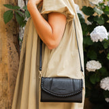 The Louenhide Harlow Crossbody Bag is a timeless, year-round wardrobe staple featuring a subtle woven vegan leather trim. Whether you are heading to brunch or afternoon drinks, the detachable and adjustable crossbody strap allows you to seamlessly transition the Harlow from crossbody to clutch. With the two thoughtfully designed compartments and large zip pocket, organize your daily essentials with ease. Designed with an envelope silhouette to pair seamlessly with your wardrobe.