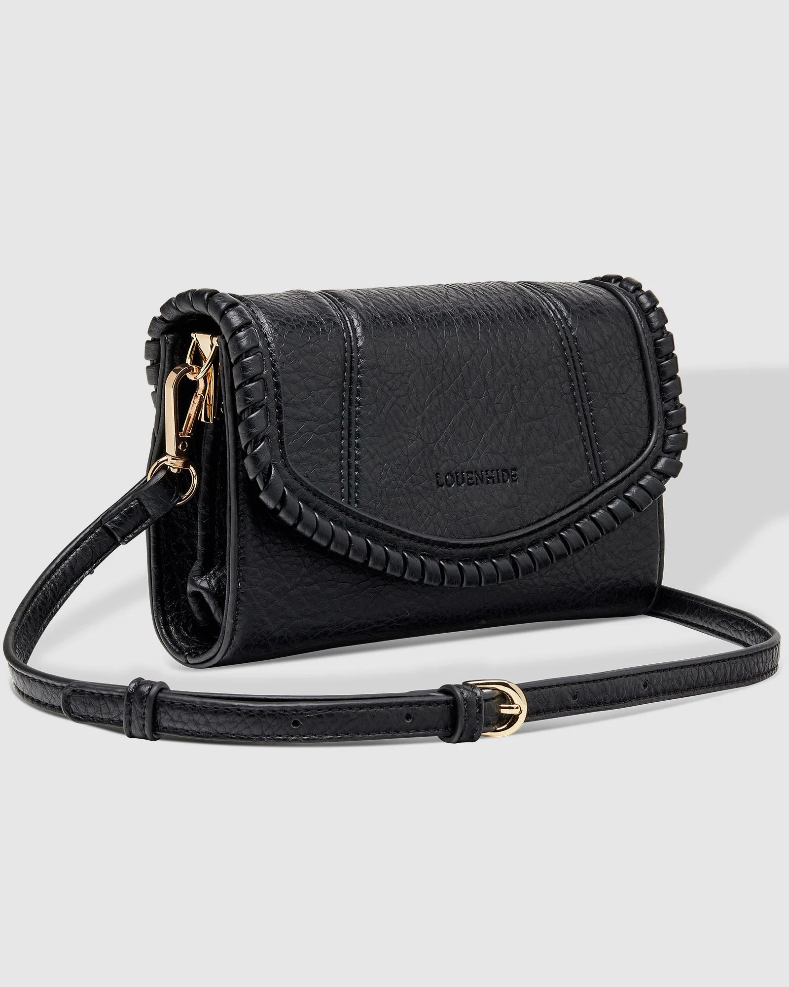 The Louenhide Harlow Crossbody Bag is a timeless, year-round wardrobe staple featuring a subtle woven vegan leather trim. Whether you are heading to brunch or afternoon drinks, the detachable and adjustable crossbody strap allows you to seamlessly transition the Harlow from crossbody to clutch. With the two thoughtfully designed compartments and large zip pocket, organize your daily essentials with ease. Designed with an envelope silhouette to pair seamlessly with your wardrobe.