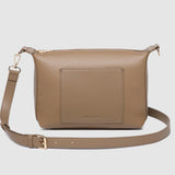 Brown pleather crossbody bag on a light gray background