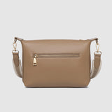 Brown pleather handbag with gold zipper on a light gray background