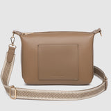 Beige handbag with a strap on a light gray background