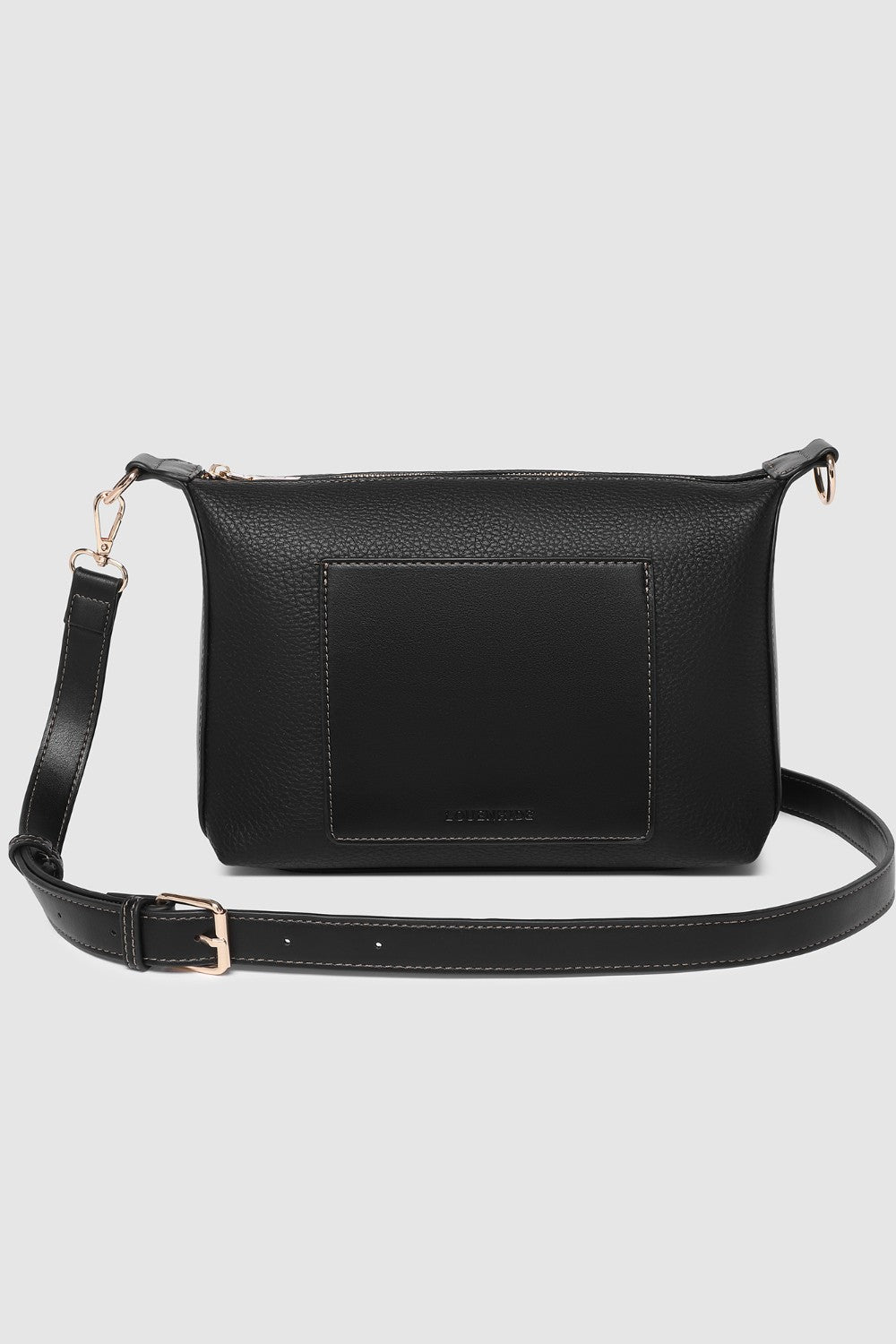 Black pleather crossbody bag on a light gray background
