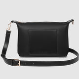 Black pleather crossbody bag on a light gray background